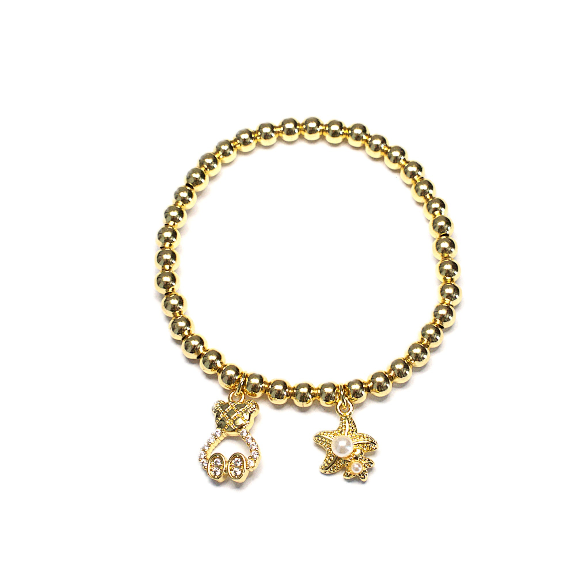 Brățară pe elastic cu biluțe aurii și pandantive ursuleț și stea de mare