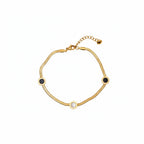 Brățară de picior aurie din oțel inoxidabil, model elegant și delicat cu cercuri albe si negre pe un lant tip sarpe