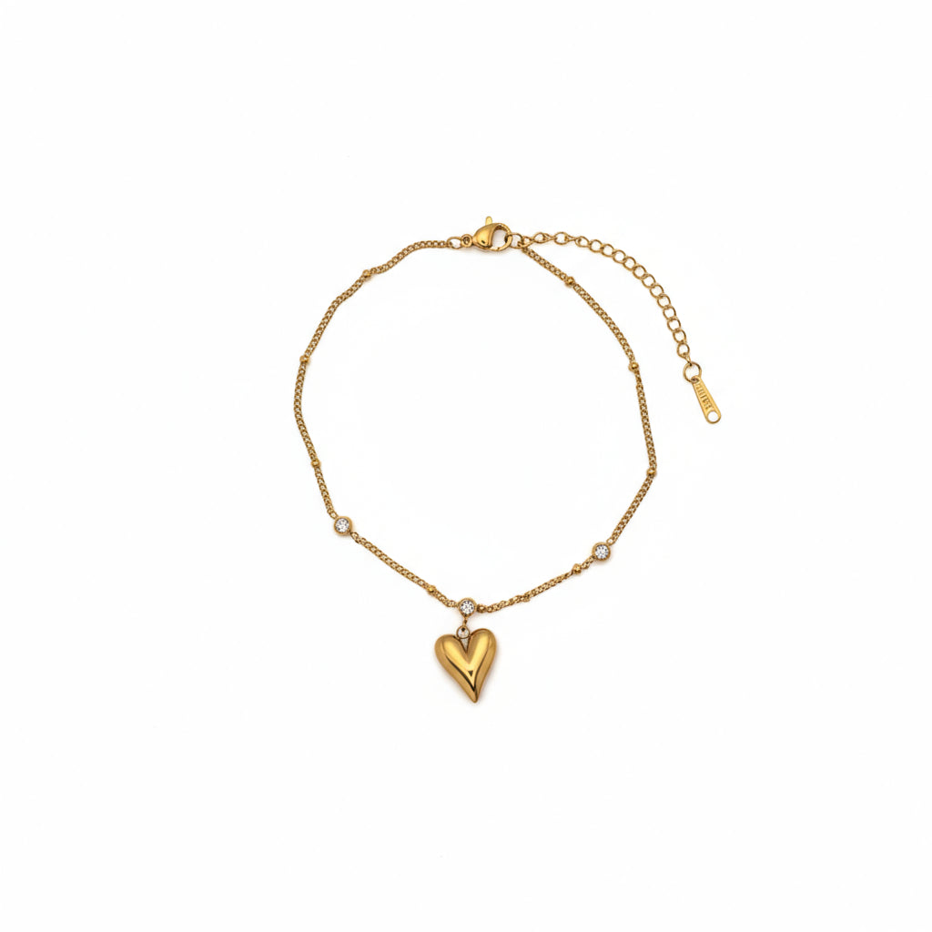 Brățară de picior modernă și strălucitoare, accesoriu feminin din lant cu 3 pietricele si un pandantiv cu inima aurie plina.
