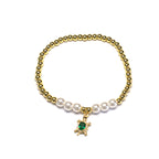 Brățară pe elastic cu bile albe și aurii și charm testoasa