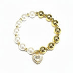 Brățară pe elastic cu bile albe și aurii și charm