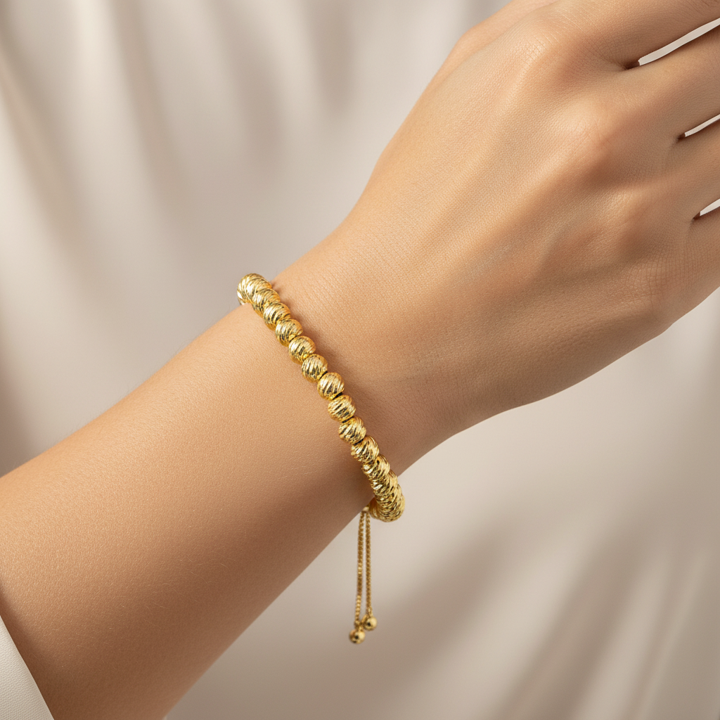 Brățară reglabilă cu bile aurii